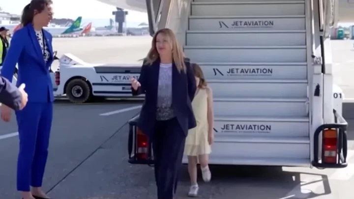 Giorgia Meloni’s camera-shy daughter hides behind mother as pair arrive for G7 summit